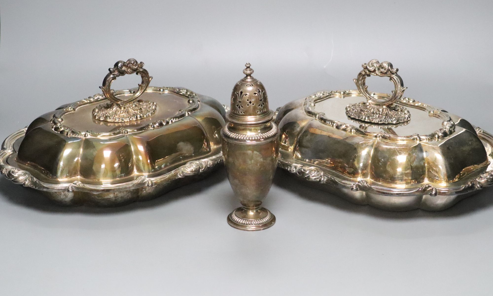 A pair of Victorian plated tureens and a plater sugar sifter